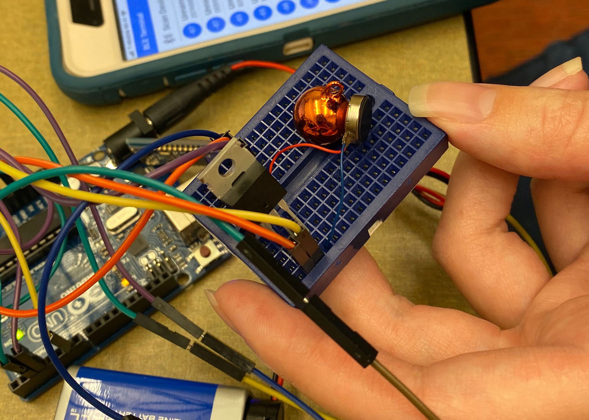 mini breadboard with TOTOT vibrating disk with a bell affixed